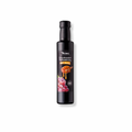 Minos Balsamessig mit Honig in einer 250ml Flasche, präsentiert auf einem Holzuntergrund. Die Etikette zeigt die goldene Farbe des Essigs, die auf die hochwertige Qualität und den natürlichen Geschmack des Produkts hinweist